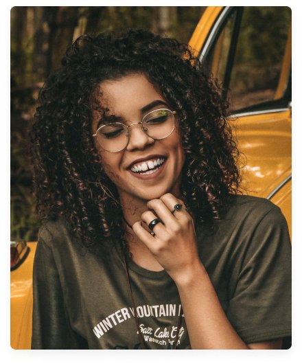 women in curls smiling