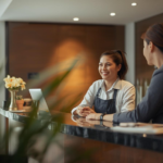 Weekend front desk job employee assisting guests at hotel reception desk